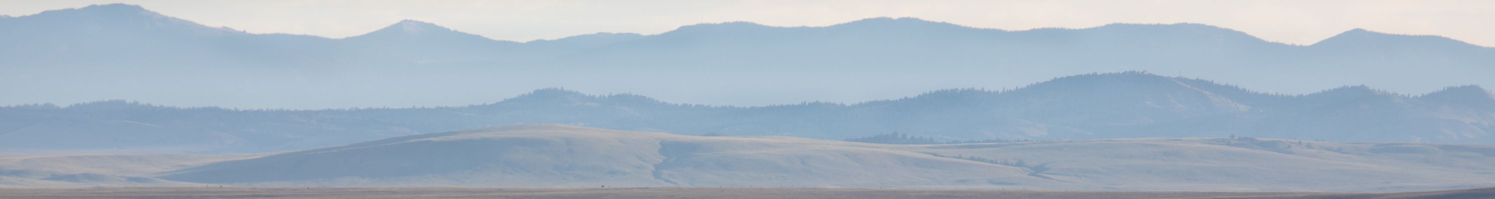 Lanscape Photography of hazy layers of mountains in the Rocky Mountains 